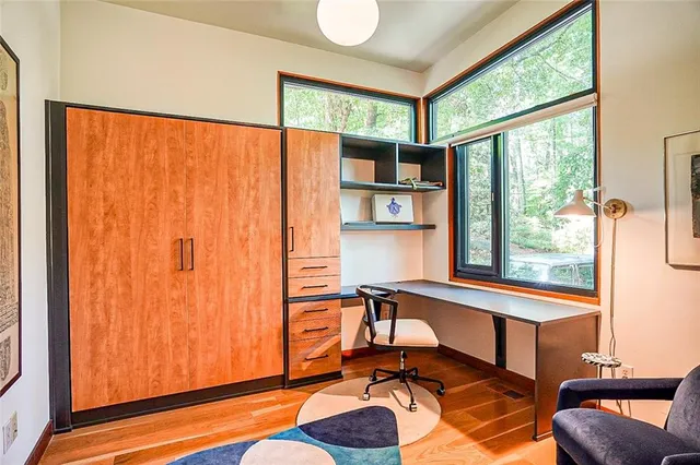 a view of a room with a window and a bed