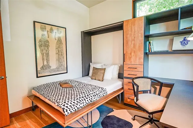 a bedroom with a bed and window