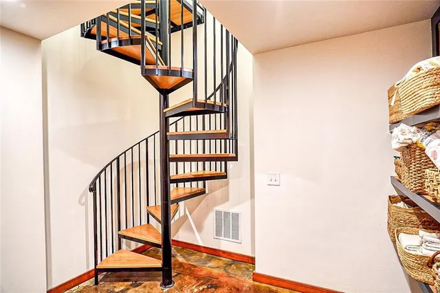 a view of staircase with black and white walls