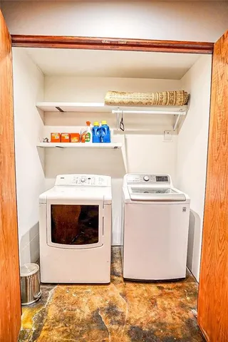 a utility room with washer and dryer