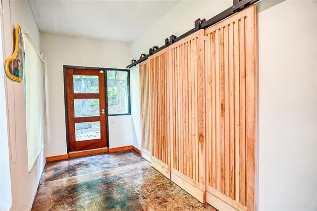 a view of a big room with windows