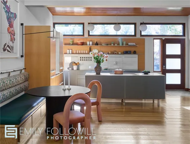 a dining room with furniture and window