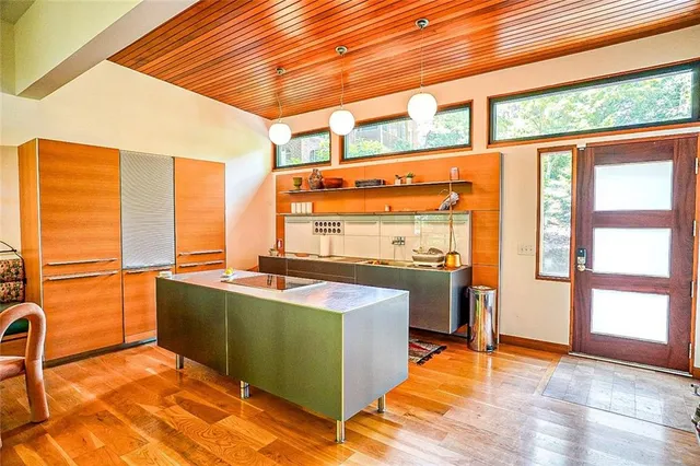 a view of a living room with furniture and a window