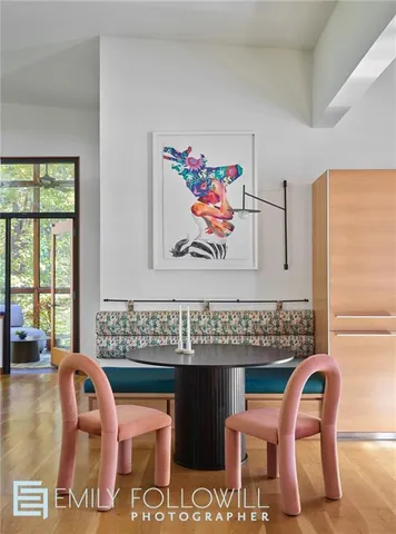 a view of a dining room with furniture and window