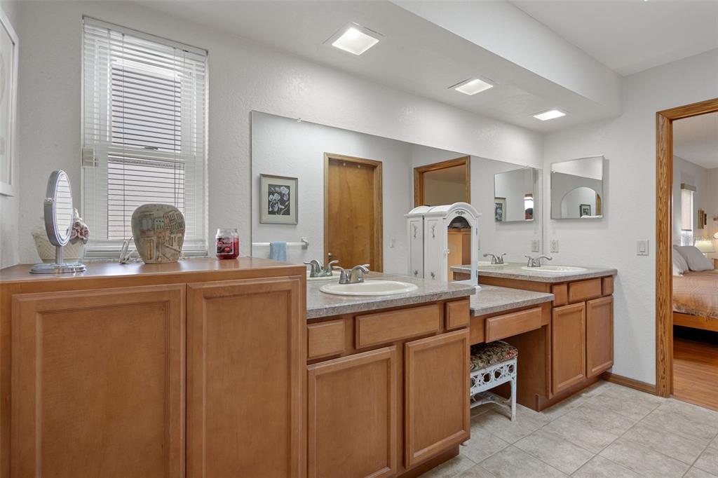 5035 Harbinger Road Spring Hill, FL 34608 - Photo 35 of 47 a kitchen with sink and mirror