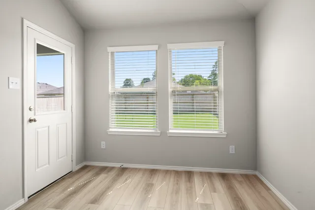 a view of an empty room with a window