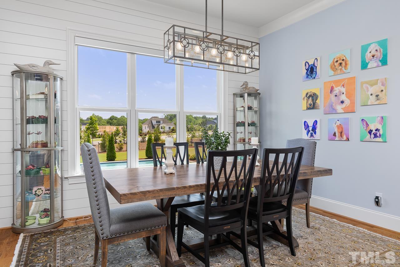 1709 Montvale Grant Way Apex, NC 27523 - Photo 16 of 68 a view of a dining room with furniture window and outside view