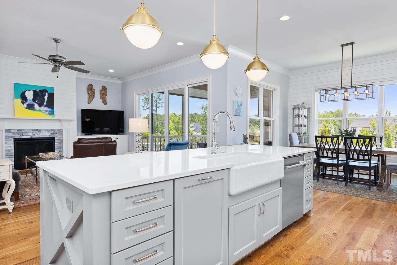 1709 Montvale Grant Way Apex, NC 27523 - Photo 20 of 68 a large kitchen with stainless steel appliances a large center island attached withe living room
