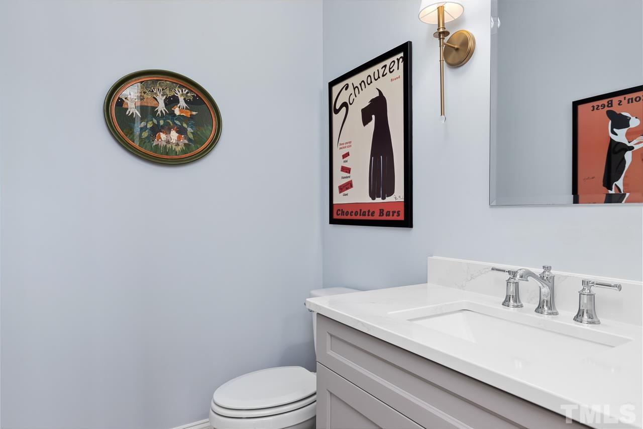 1709 Montvale Grant Way Apex, NC 27523 - Photo 23 of 68 a bathroom with a toilet and a sink