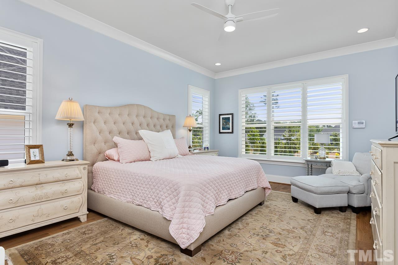 1709 Montvale Grant Way Apex, NC 27523 - Photo 24 of 68 a bedroom with a bed and a couch