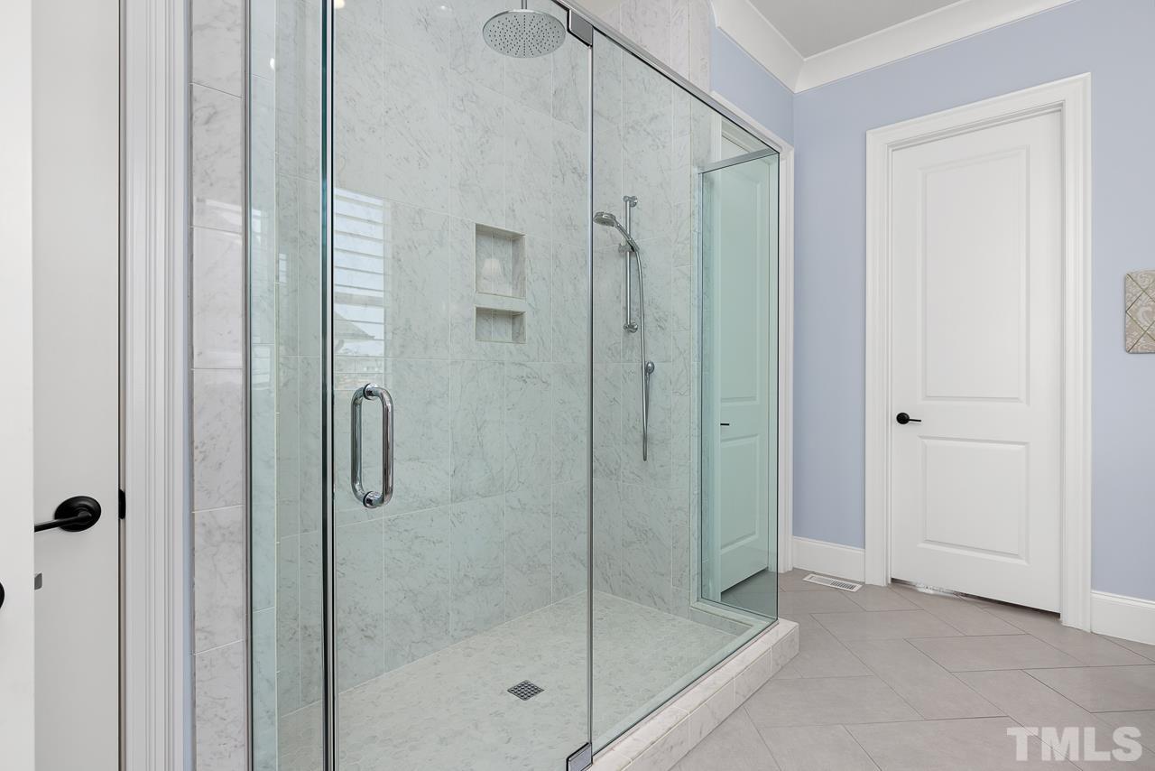 1709 Montvale Grant Way Apex, NC 27523 - Photo 28 of 68 a bathroom with a shower