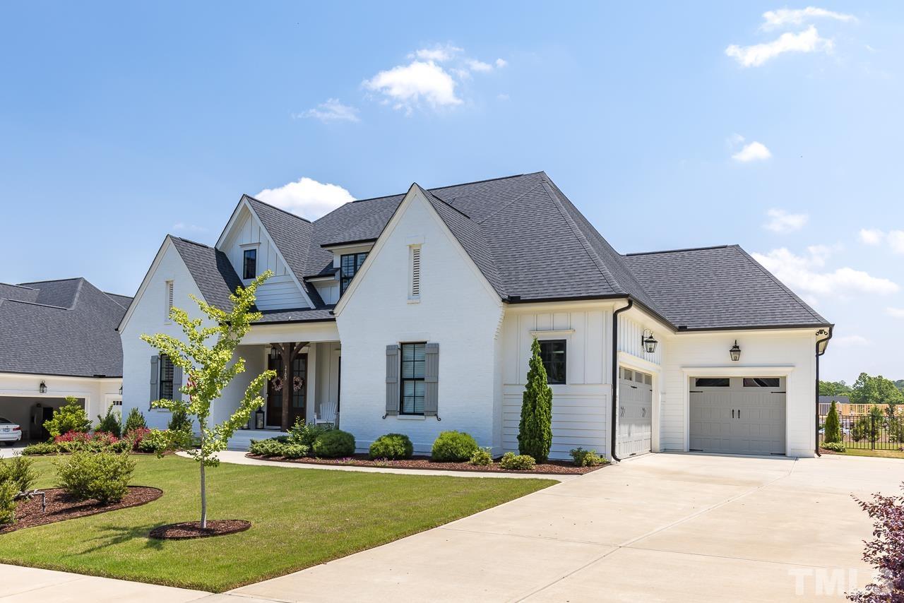 1709 Montvale Grant Way Apex, NC 27523 - Photo 3 of 68 a front view of a house with a yard