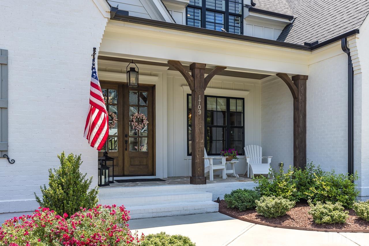 1709 Montvale Grant Way Apex, NC 27523 - Photo 5 of 68 a front view of a house with plants