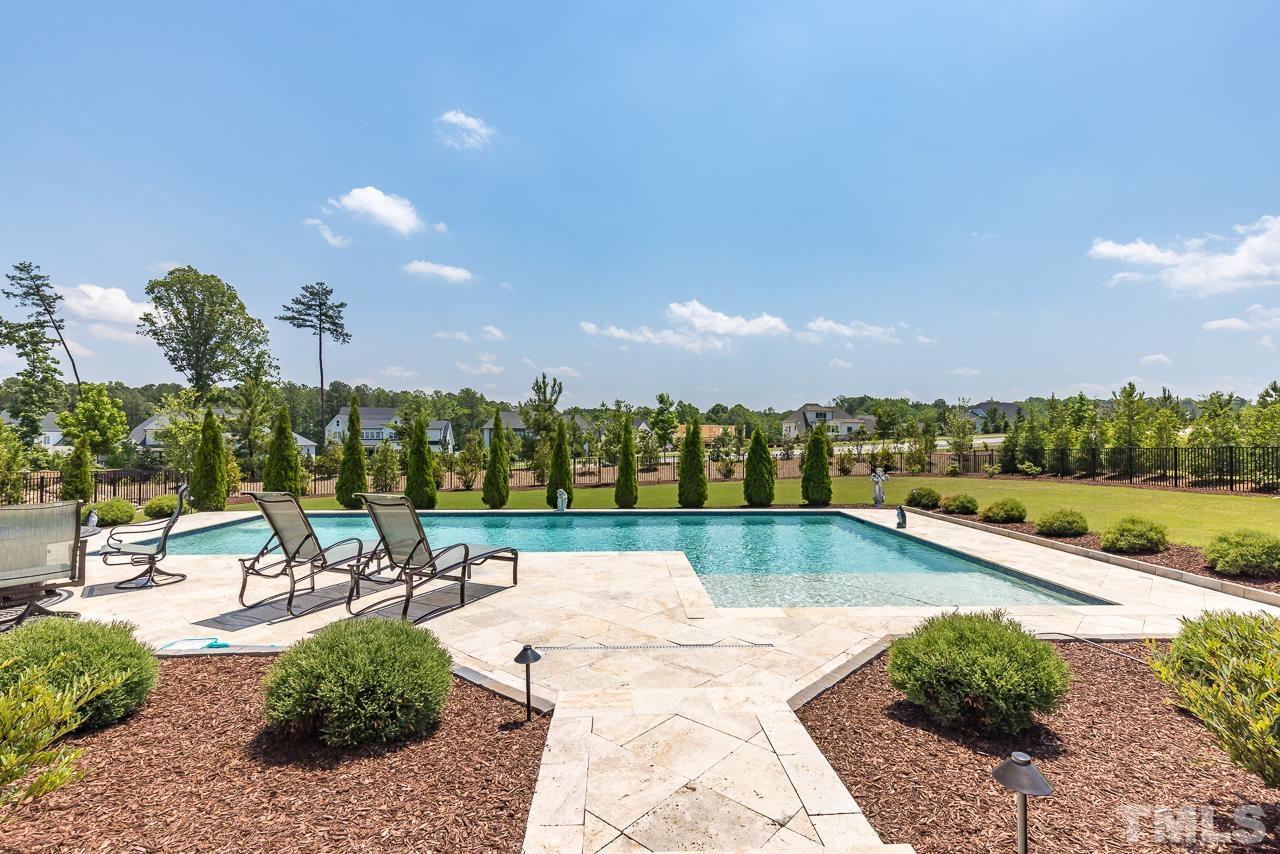 1709 Montvale Grant Way Apex, NC 27523 - Photo 52 of 68 a view of a swimming pool and lake view