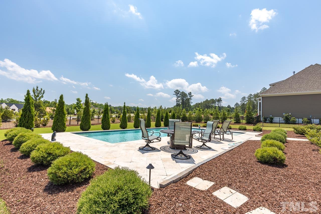 1709 Montvale Grant Way Apex, NC 27523 - Photo 53 of 68 a view of a backyard with sitting area