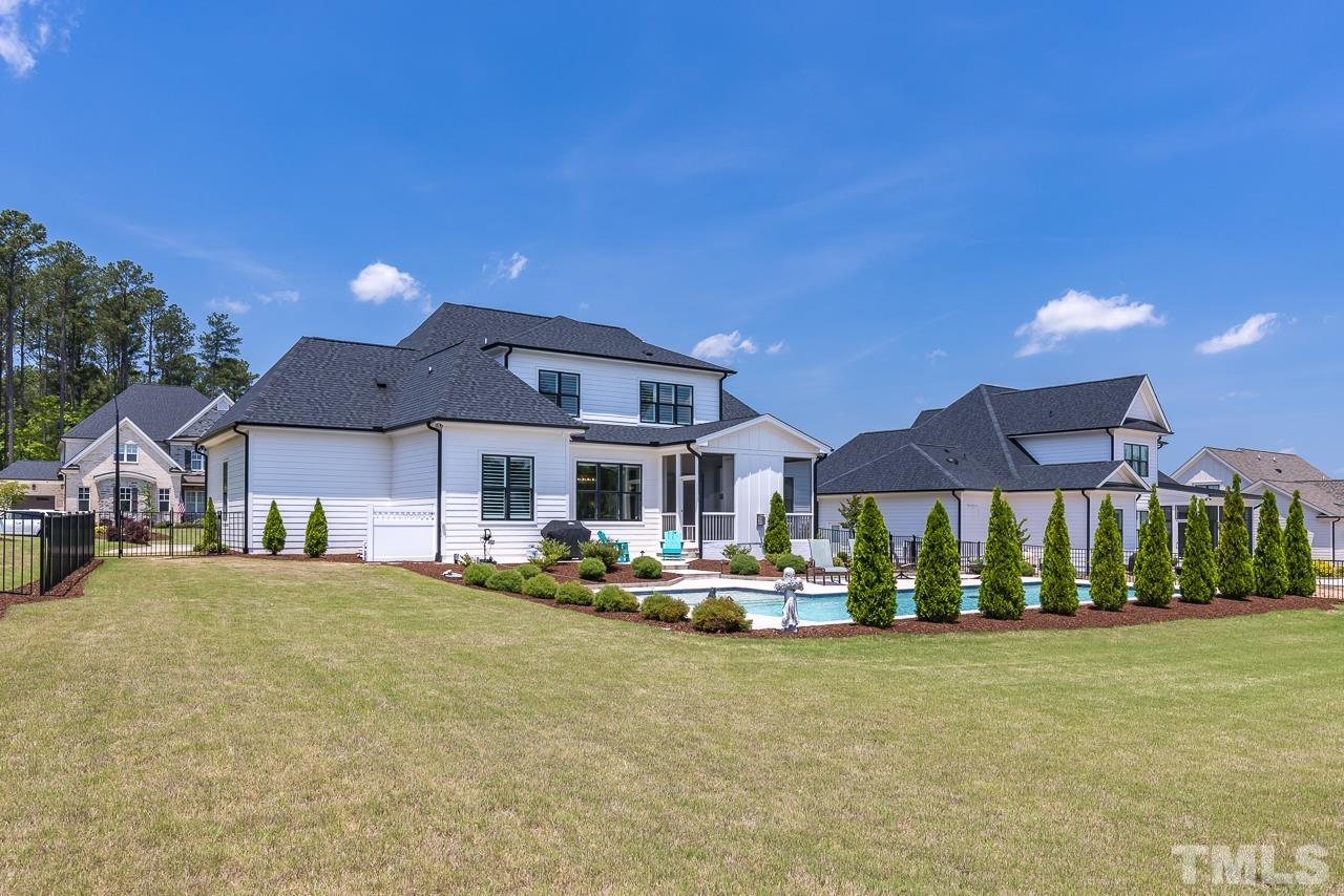 1709 Montvale Grant Way Apex, NC 27523 - Photo 58 of 68 a front view of a house with a yard