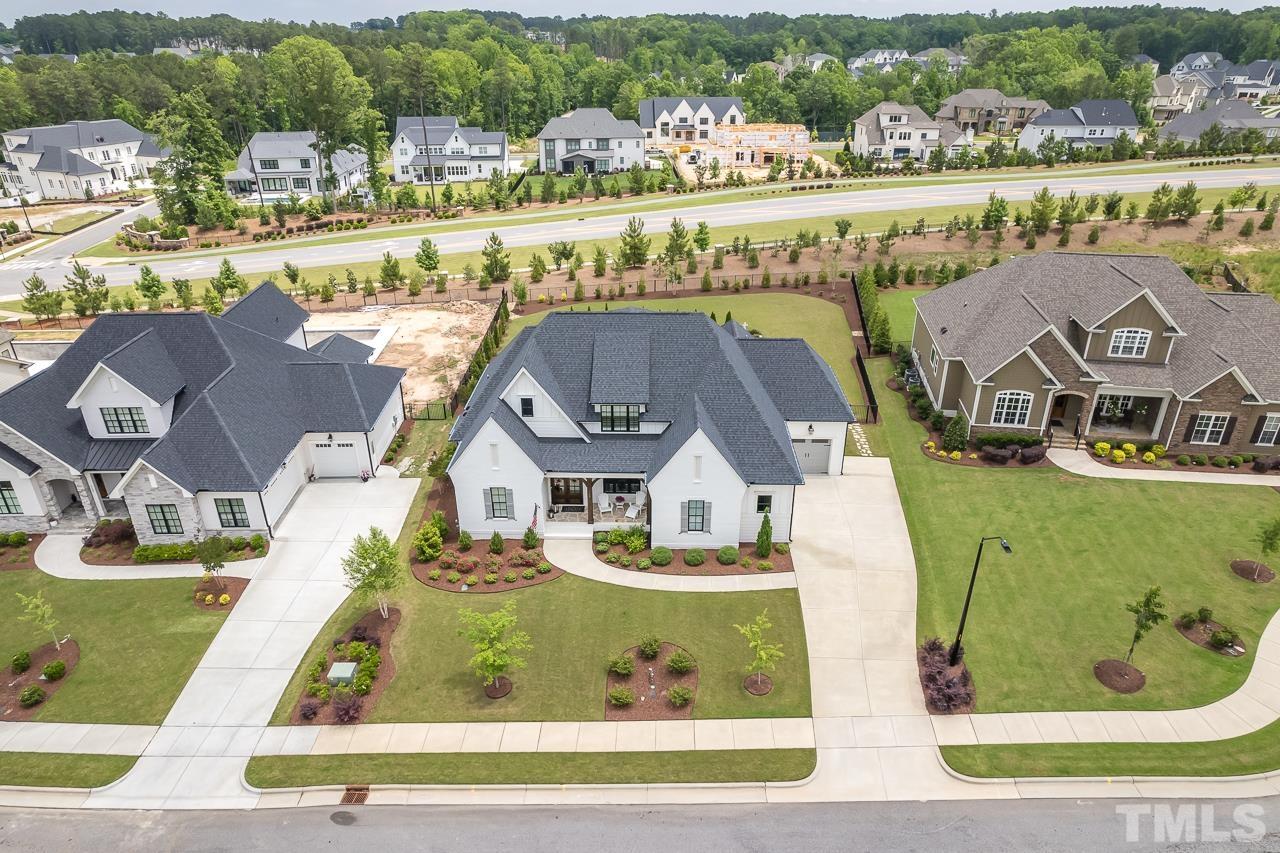 1709 Montvale Grant Way Apex, NC 27523 - Photo 59 of 68 an aerial view of residential houses with outdoor space