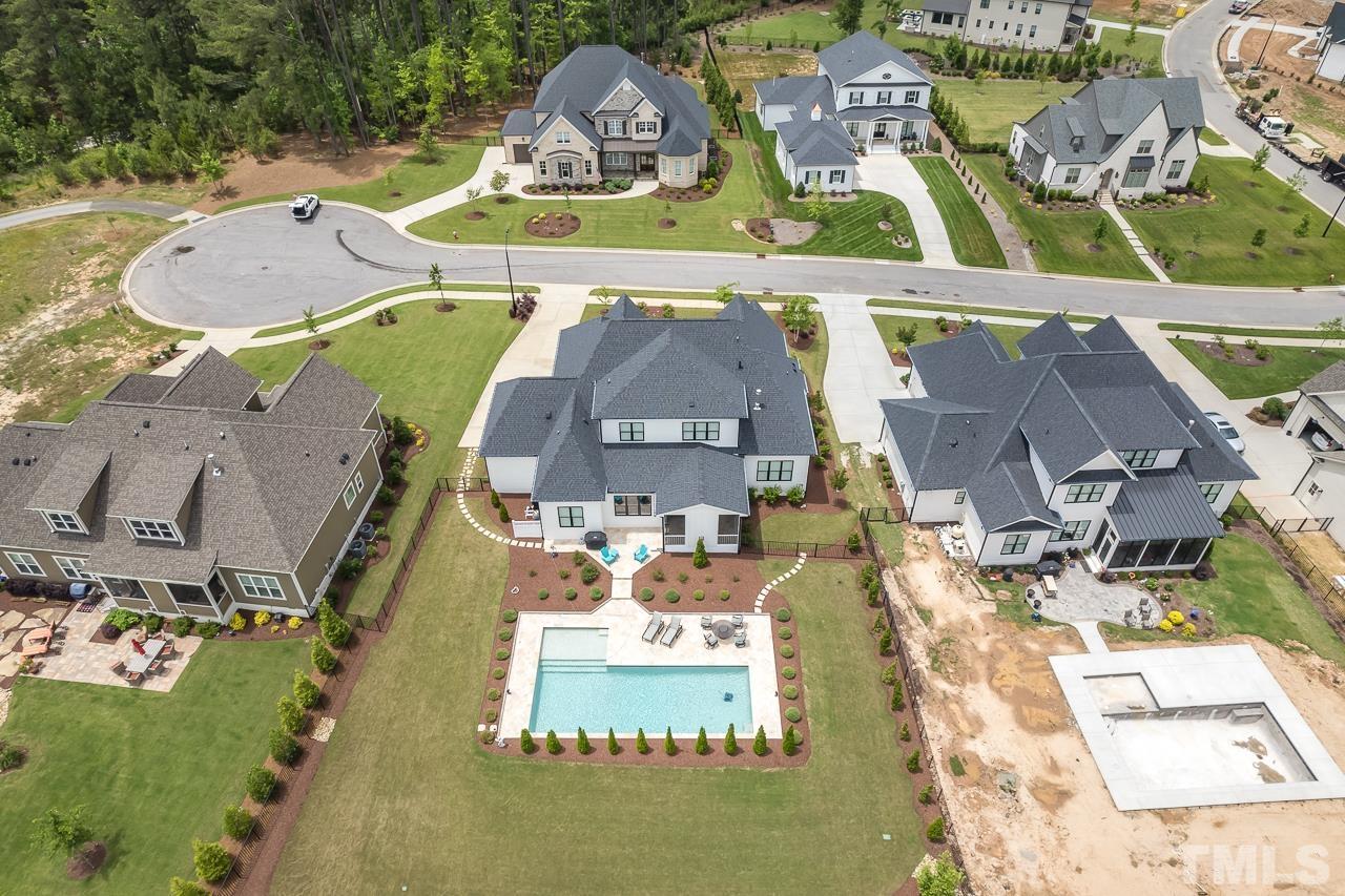 1709 Montvale Grant Way Apex, NC 27523 - Photo 61 of 68 an aerial view of a house with a swimming pool