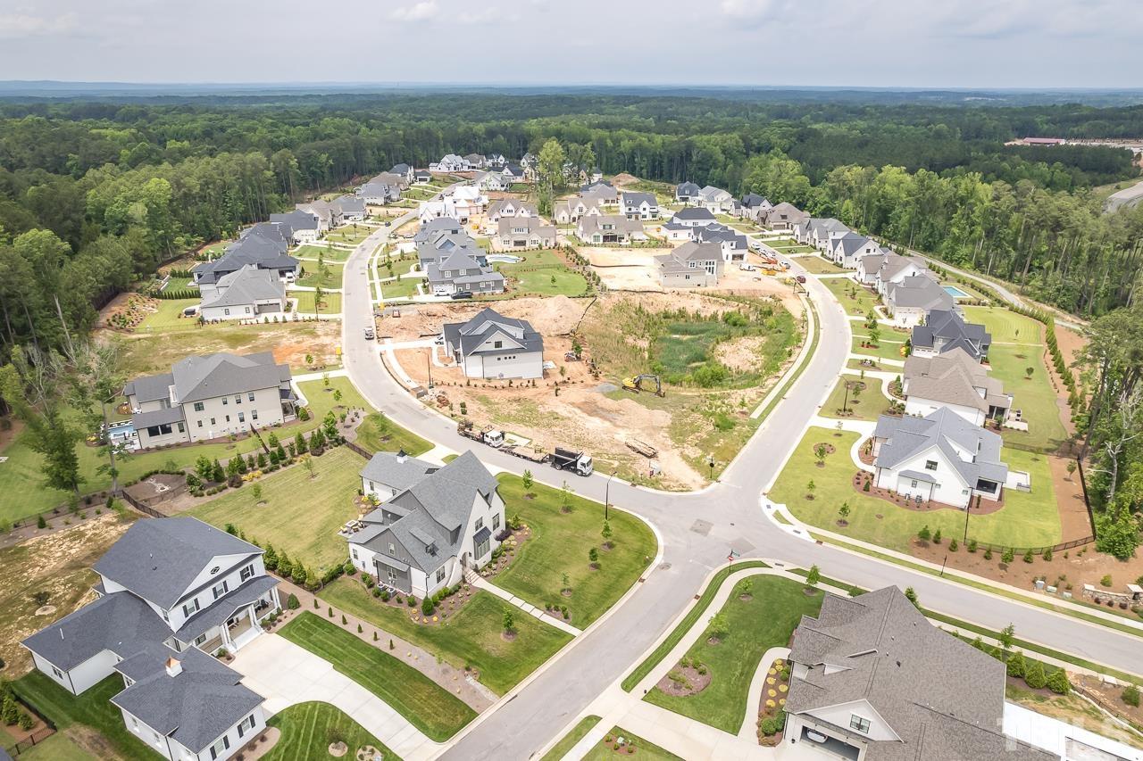 1709 Montvale Grant Way Apex, NC 27523 - Photo 66 of 68 an aerial view of a swimming pool with a garden