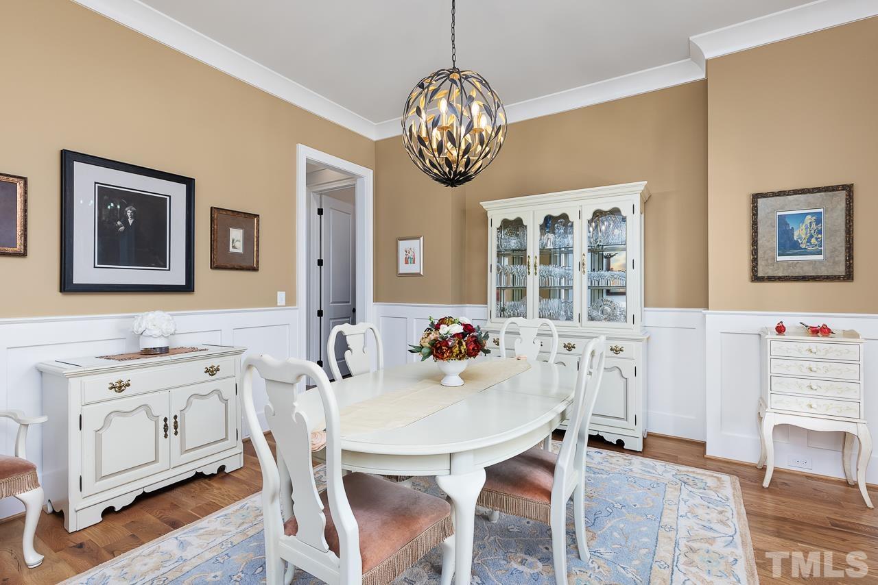 1709 Montvale Grant Way Apex, NC 27523 - Photo 8 of 68 a view of a dining room with furniture and chandelier