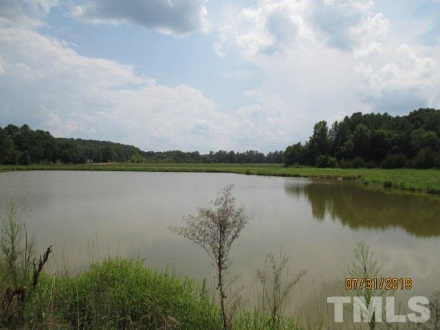 500 Bacon Road Rougemont, NC 27572 - Photo 4 of 6 a view of a lake with houses in the back