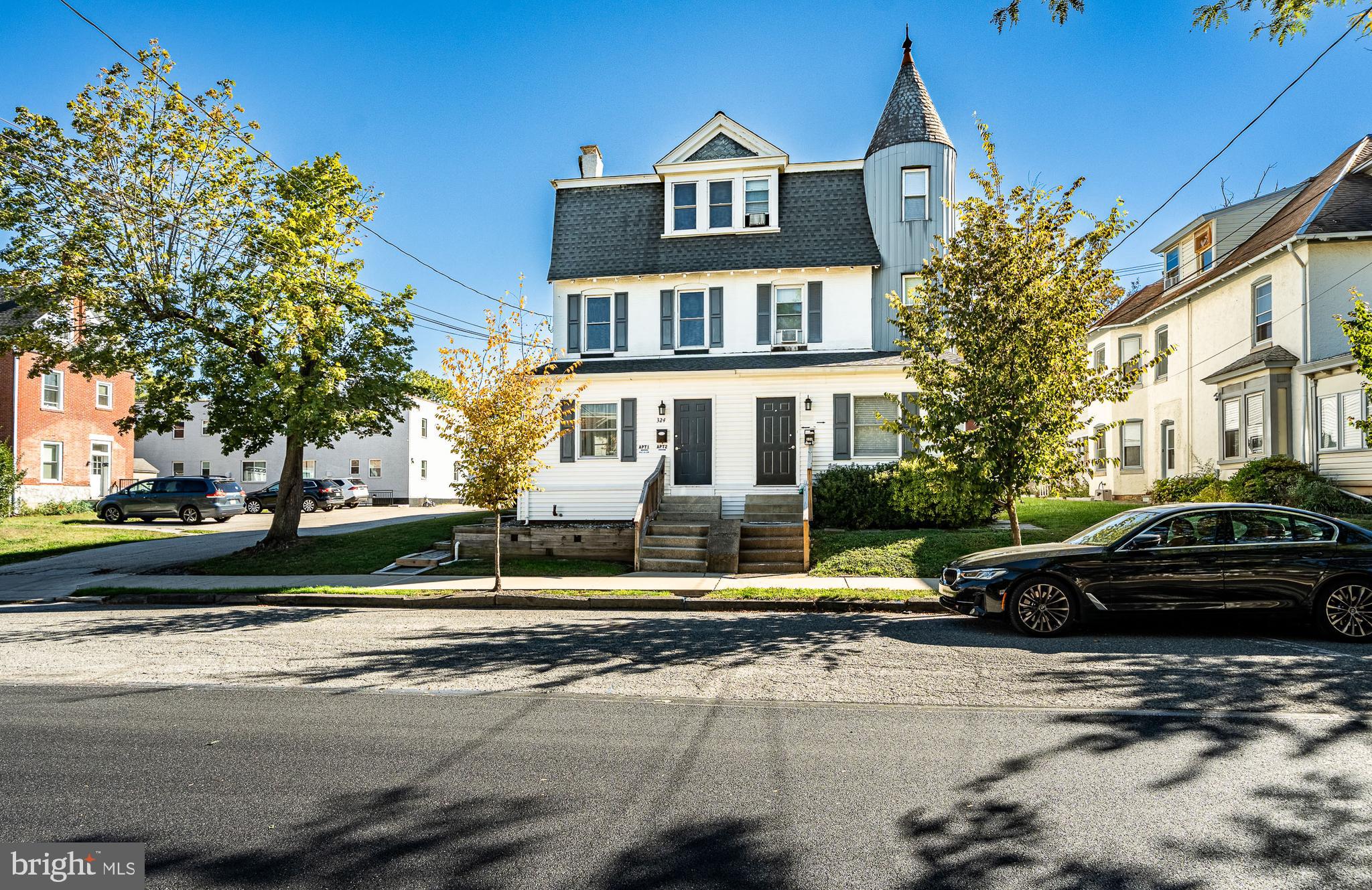 a front view of a house with a garden