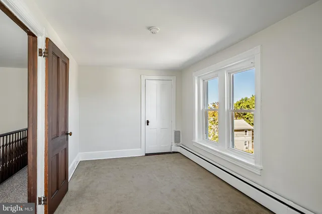 a view of an empty room and window