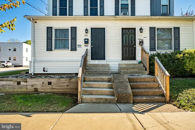 a front view of house with stairs