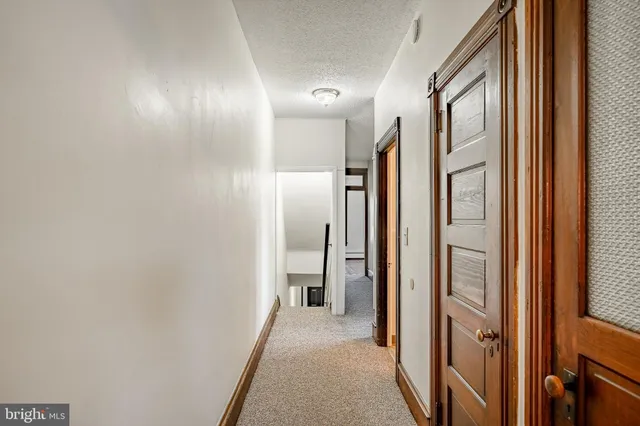 a view of hallway with shower