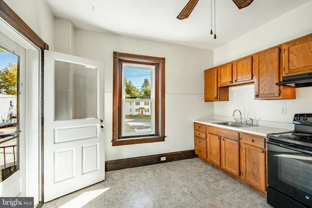 a view of a kitchen with electric appliances