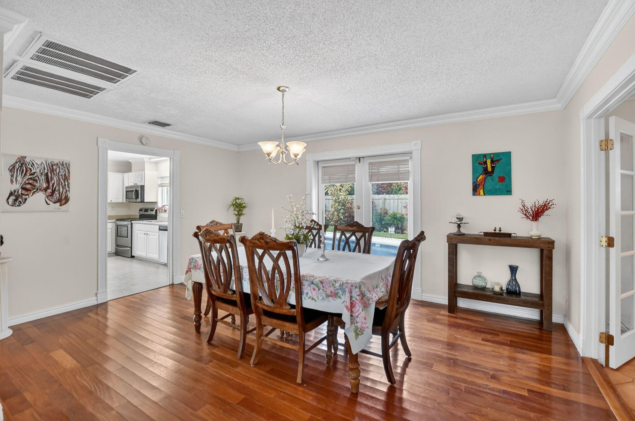 1311 Southwest 14th Avenue Boca Raton, FL 33486 - Photo 15 of 54 a view of a dining room with furniture window and wooden floor