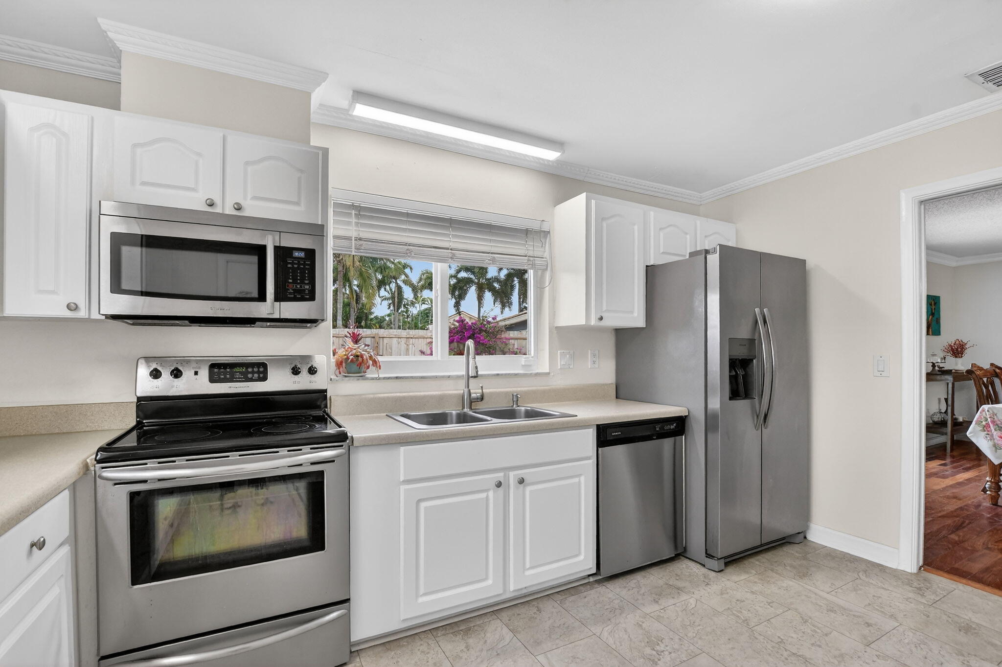 1311 Southwest 14th Avenue Boca Raton, FL 33486 - Photo 20 of 54 a kitchen with a sink stove and refrigerator