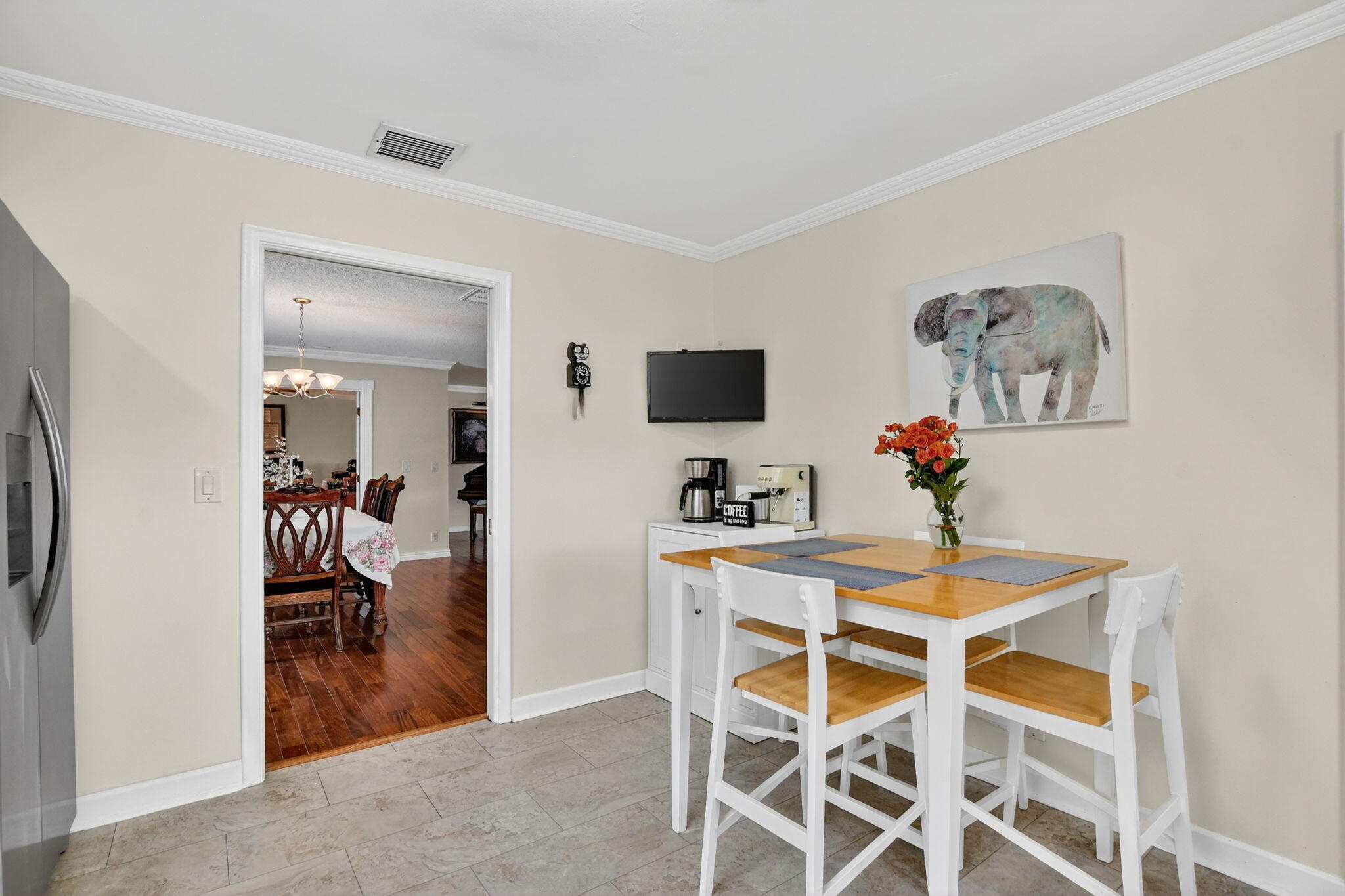 1311 Southwest 14th Avenue Boca Raton, FL 33486 - Photo 21 of 54 a view of a dining room with furniture and a livingroom