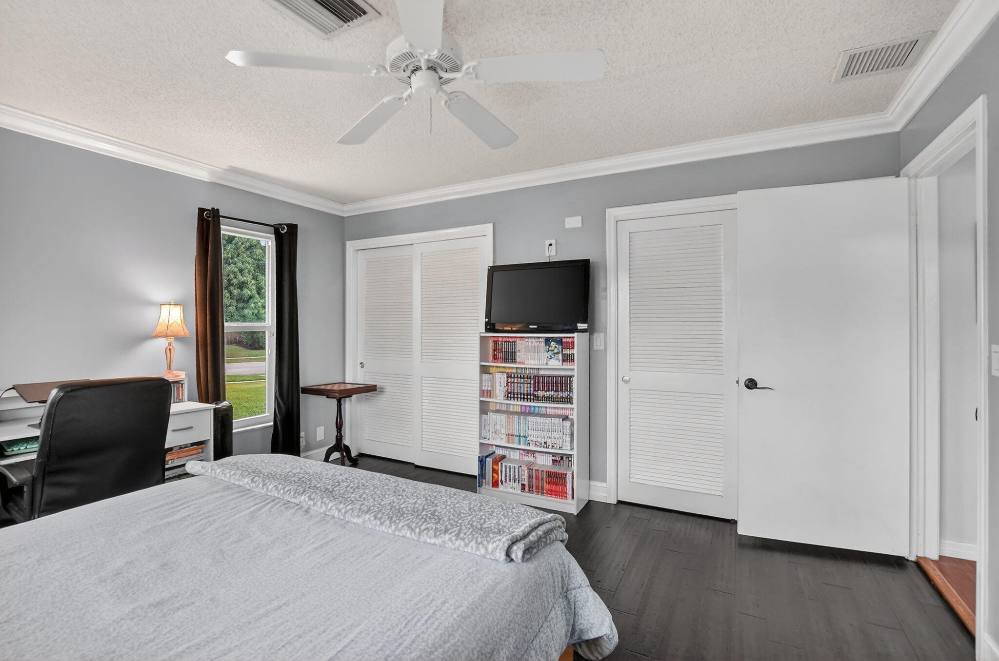 1311 Southwest 14th Avenue Boca Raton, FL 33486 - Photo 28 of 54 a bedroom with a bed and a television