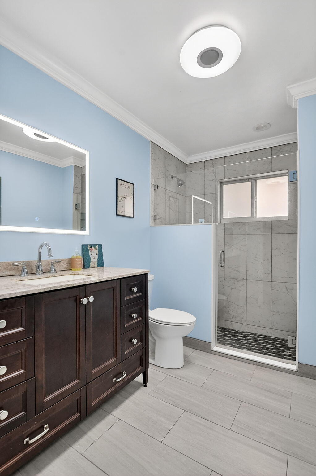 1311 Southwest 14th Avenue Boca Raton, FL 33486 - Photo 33 of 54 a bathroom with a sink mirror and a toilet