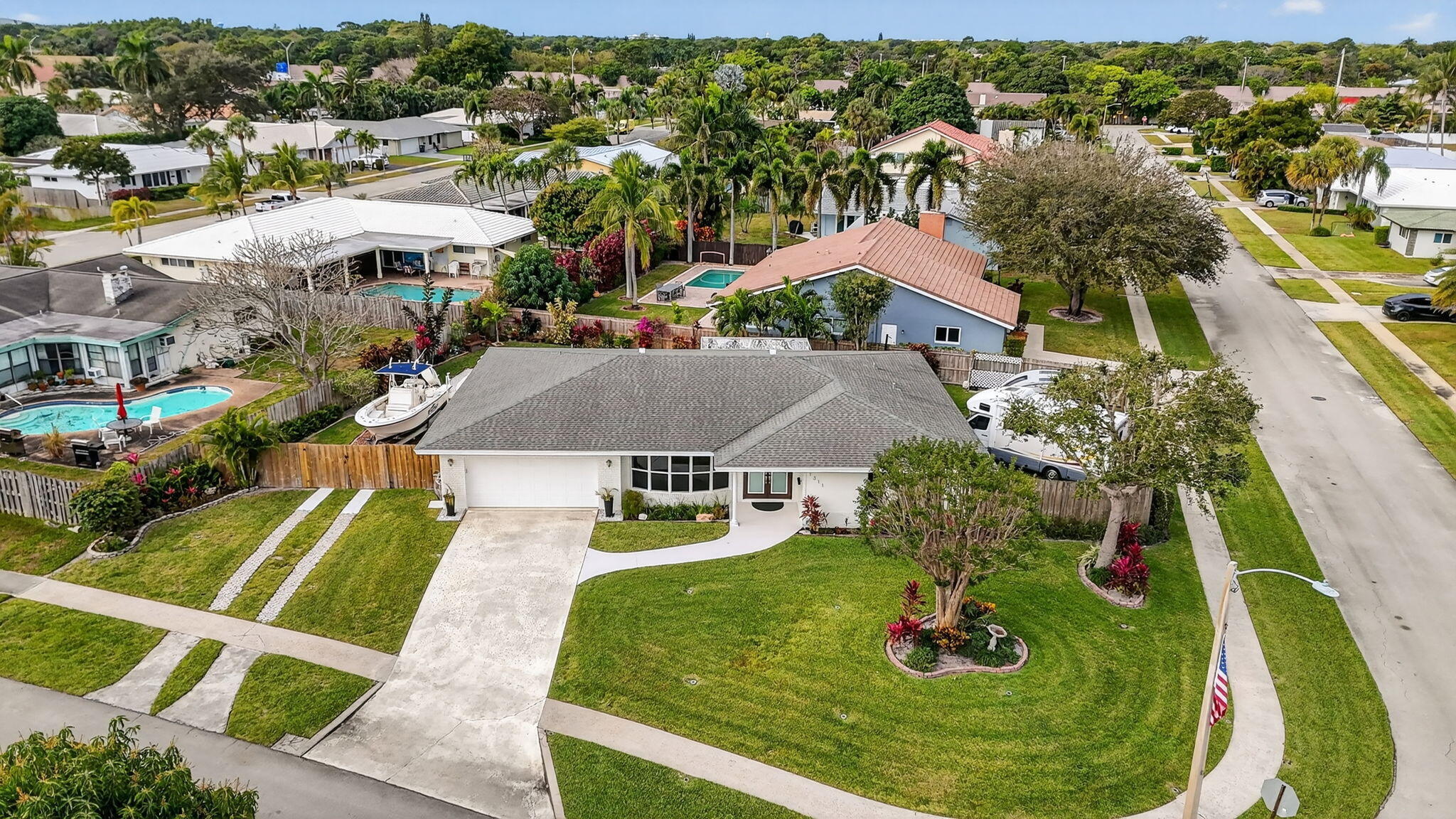 1311 Southwest 14th Avenue Boca Raton, FL 33486 - Photo 49 of 54 an aerial view of residential houses with outdoor space