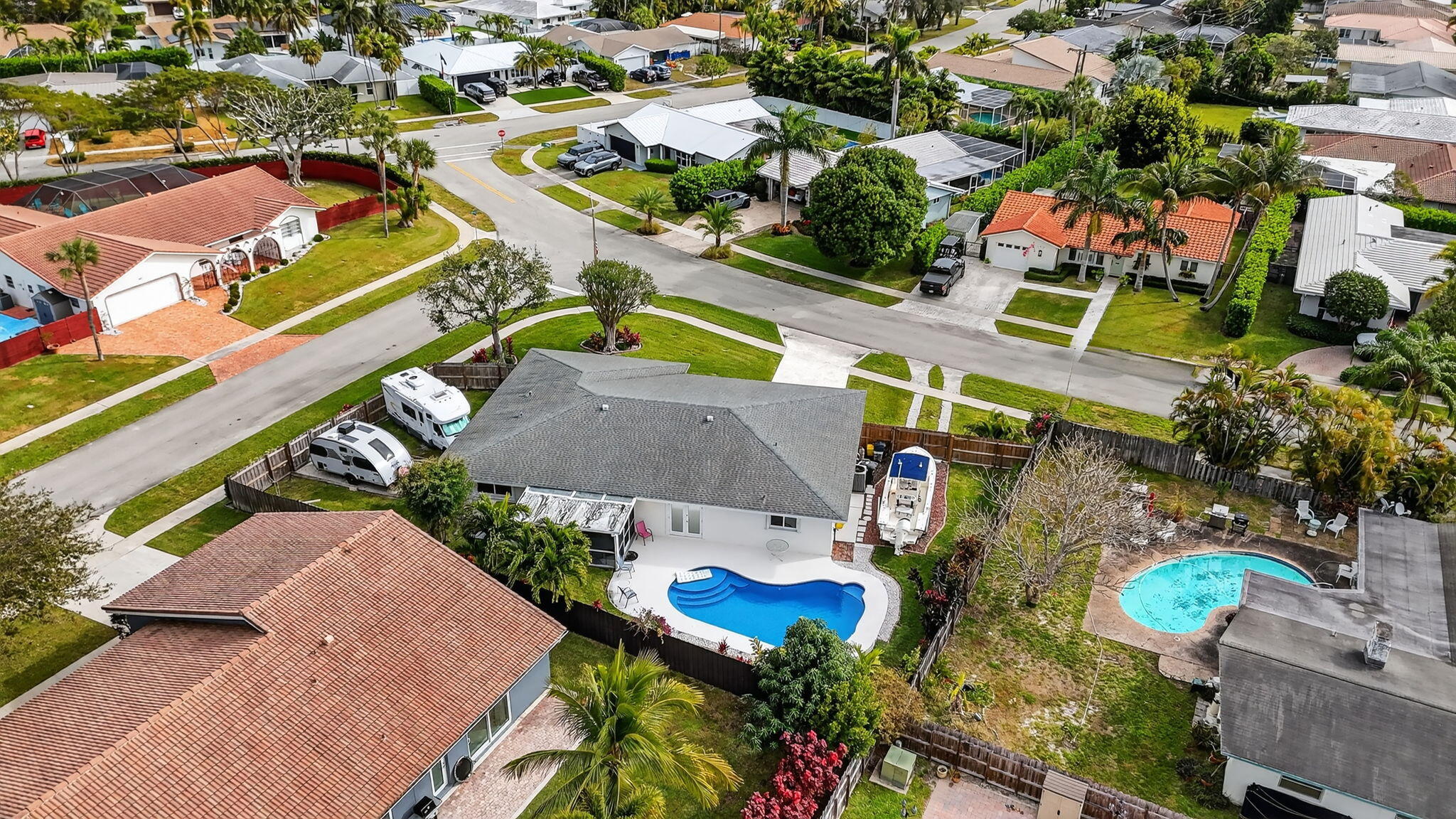1311 Southwest 14th Avenue Boca Raton, FL 33486 - Photo 54 of 54 an aerial view of a swimming pool with outdoor seating