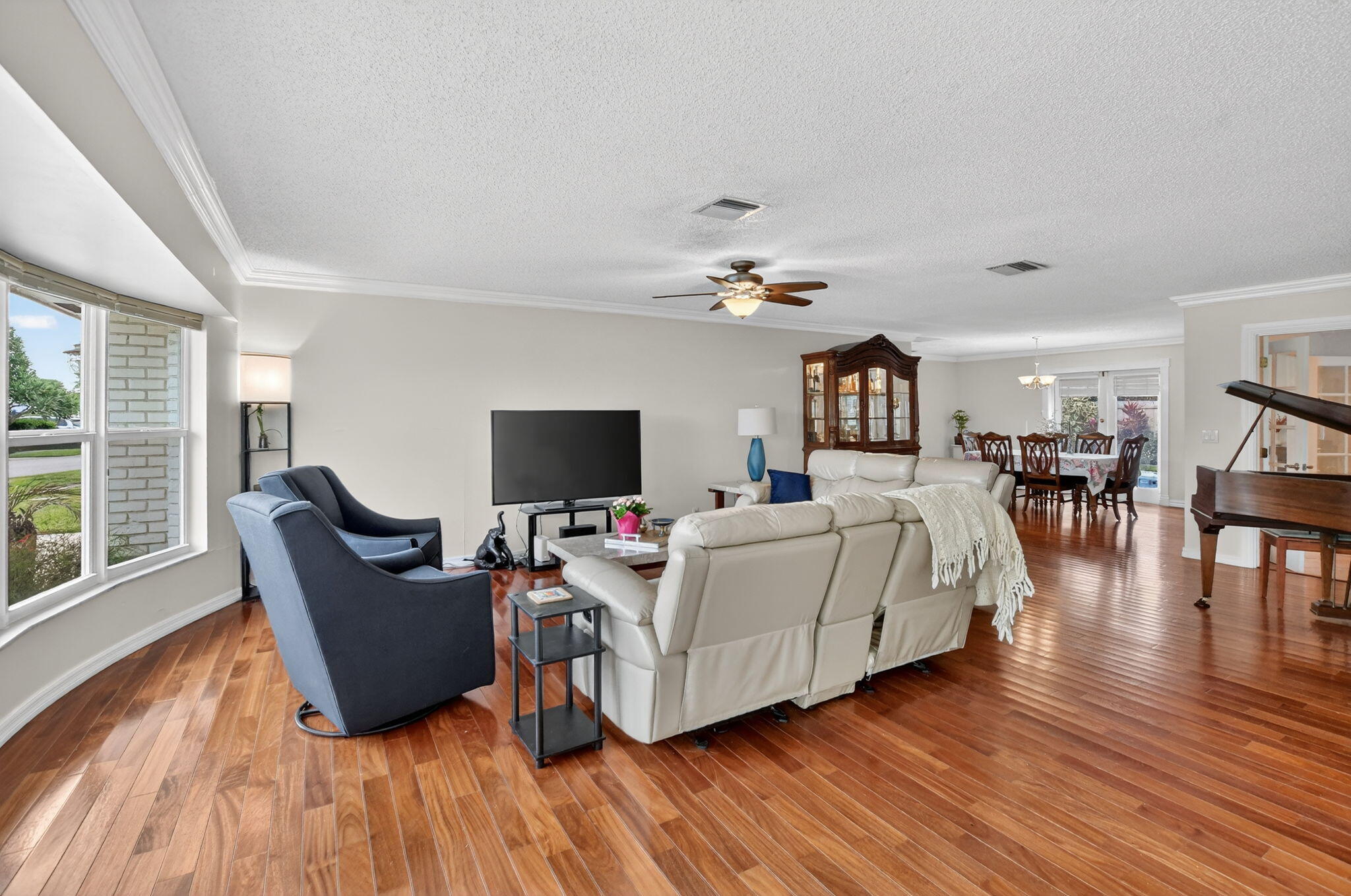 1311 Southwest 14th Avenue Boca Raton, FL 33486 - Photo 7 of 54 a living room with furniture and a flat screen tv