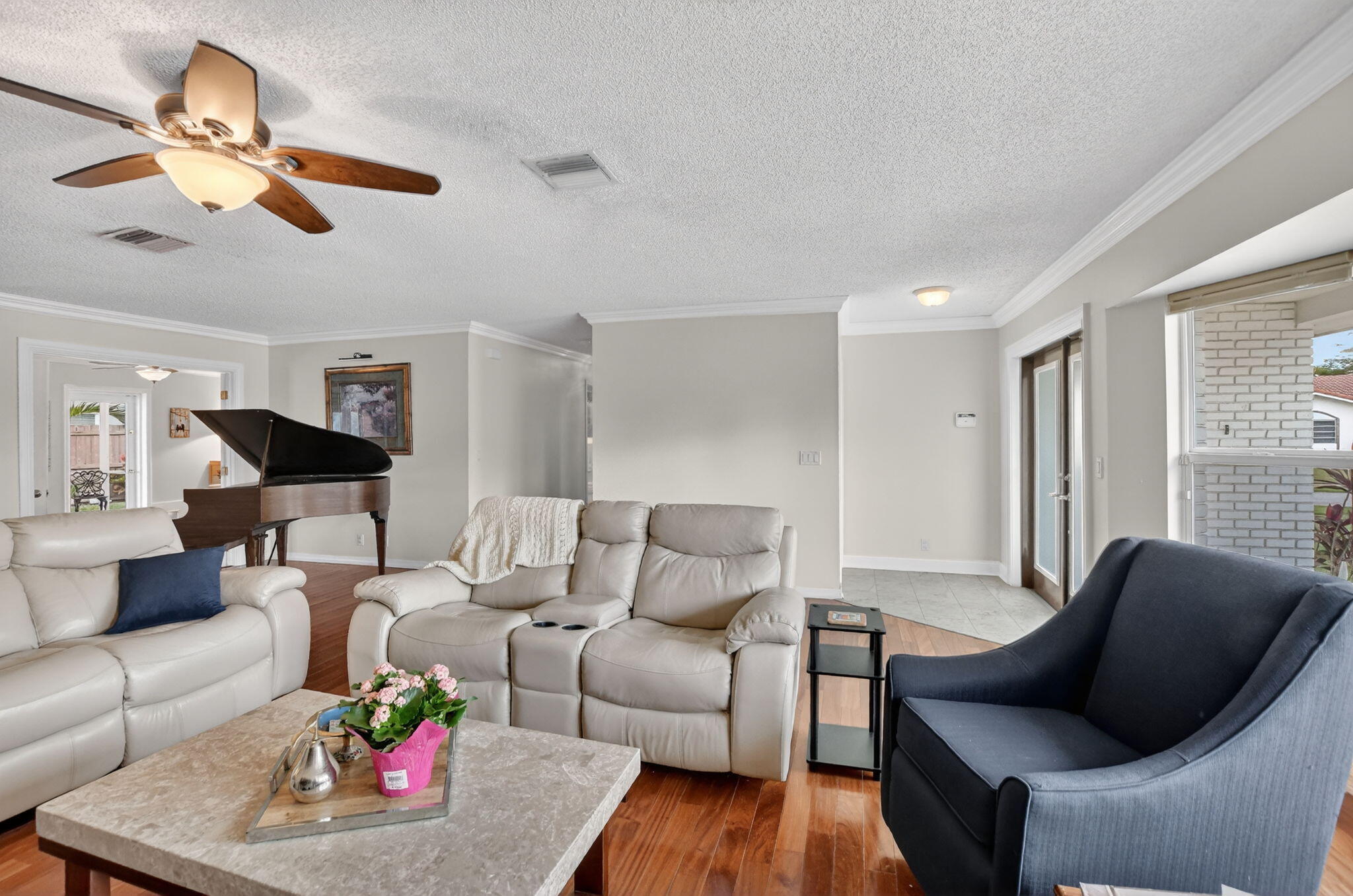 1311 Southwest 14th Avenue Boca Raton, FL 33486 - Photo 9 of 54 a living room with furniture and a large window