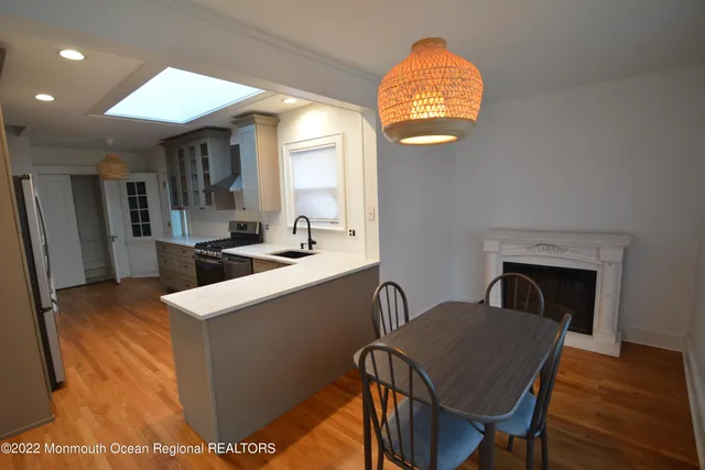 a view of kitchen with cabinets and wooden floor