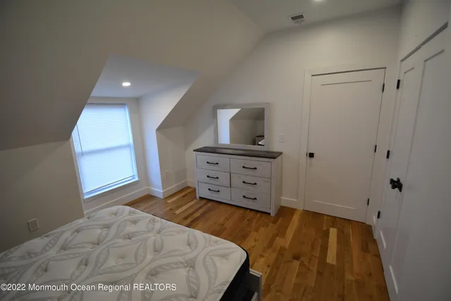 a view of a bedroom with cabinet