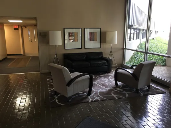 a living room with furniture and a window