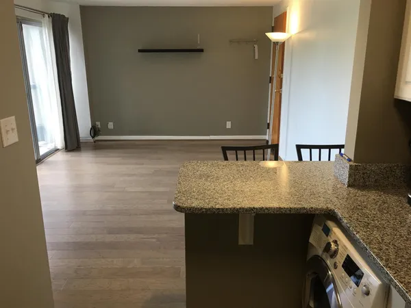 a view of a bathroom with a granite countertop sink