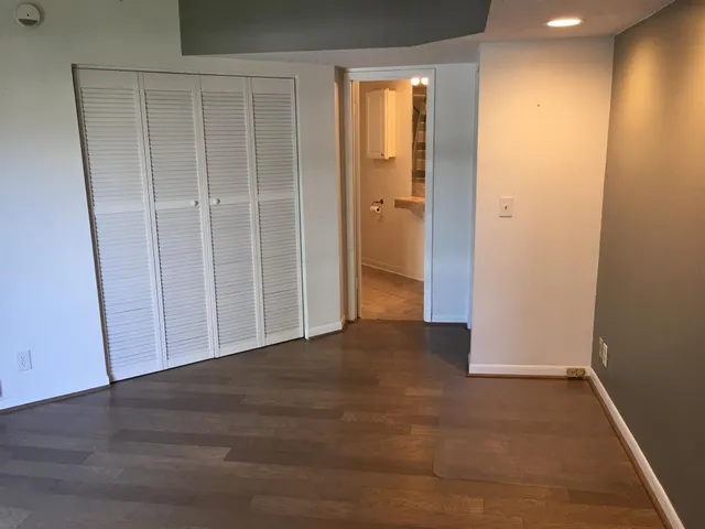 an empty room with closet area