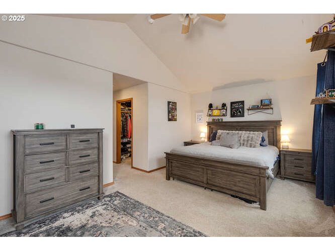 433 Southwest Pemberly Loop McMinnville, OR 97128 - Photo 12 of 24 a spacious bedroom with a bed and a mirror