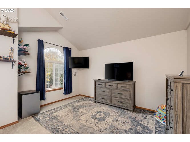 433 Southwest Pemberly Loop McMinnville, OR 97128 - Photo 13 of 24 a living room with furniture and a flat screen tv