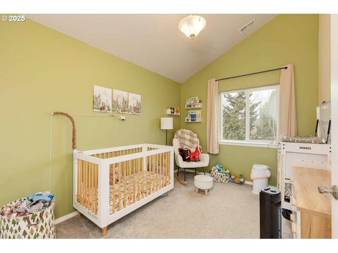 433 Southwest Pemberly Loop McMinnville, OR 97128 - Photo 16 of 24 a bedroom with a bed and window