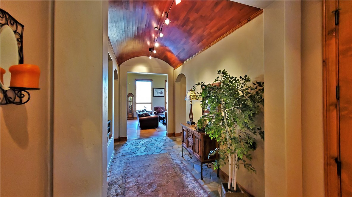 135 Game Trail Road Silverthorne, CO 80498 - Photo 2 of 34 Mesquite barrel roll ceiling in entry.