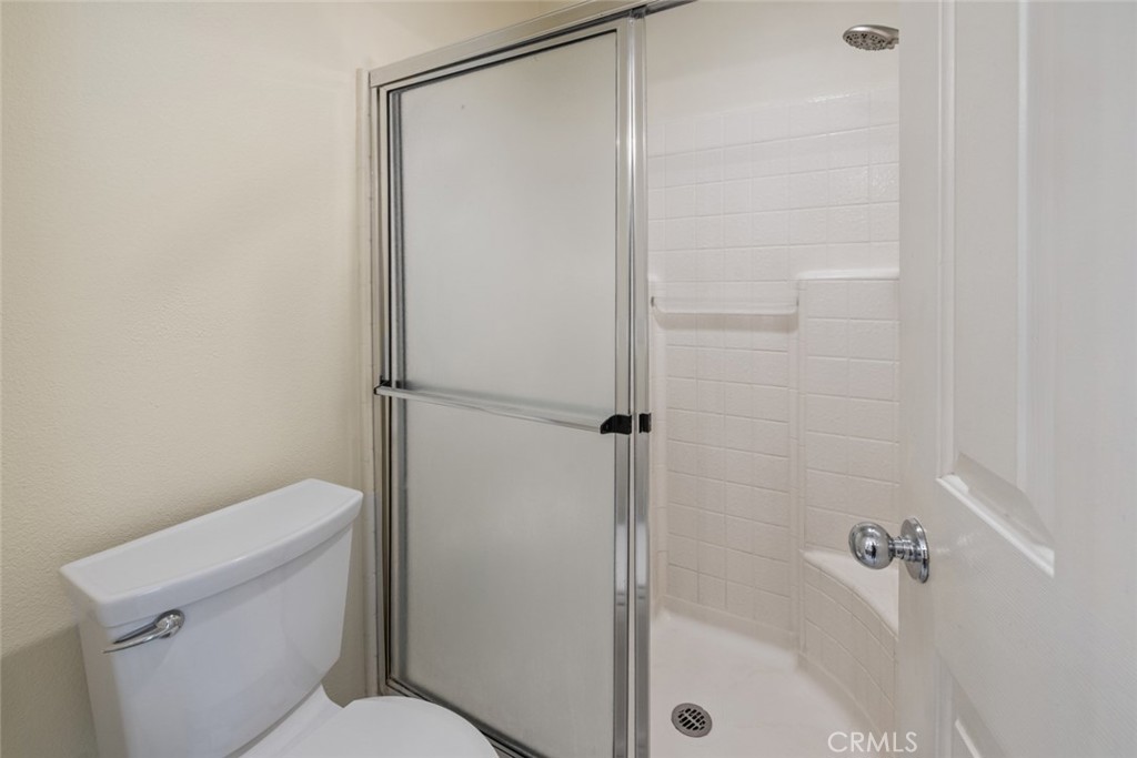 5 Montara Drive Aliso Viejo, CA 92656 - Photo 14 of 26 a bathroom with a shower a toilet and a shower