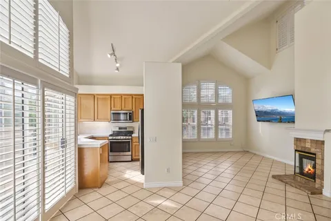 a view of a kitchen with microwave and a stove top oven